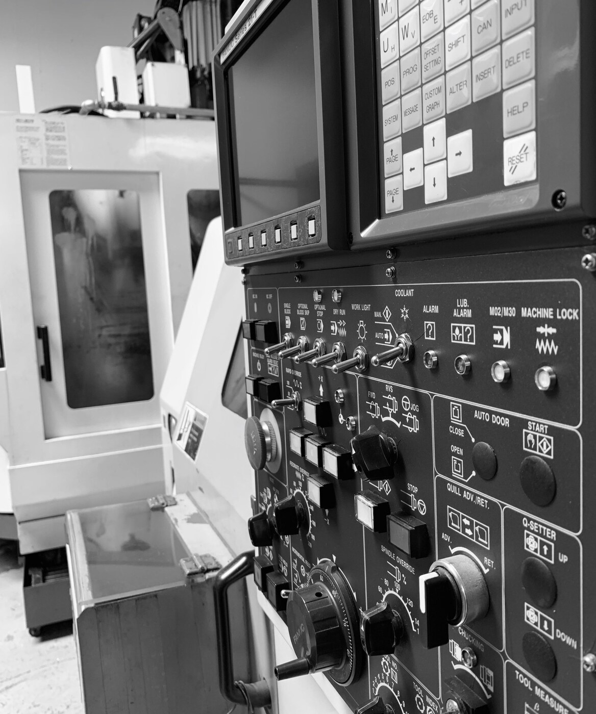 CNC machine control panel with switches and buttons