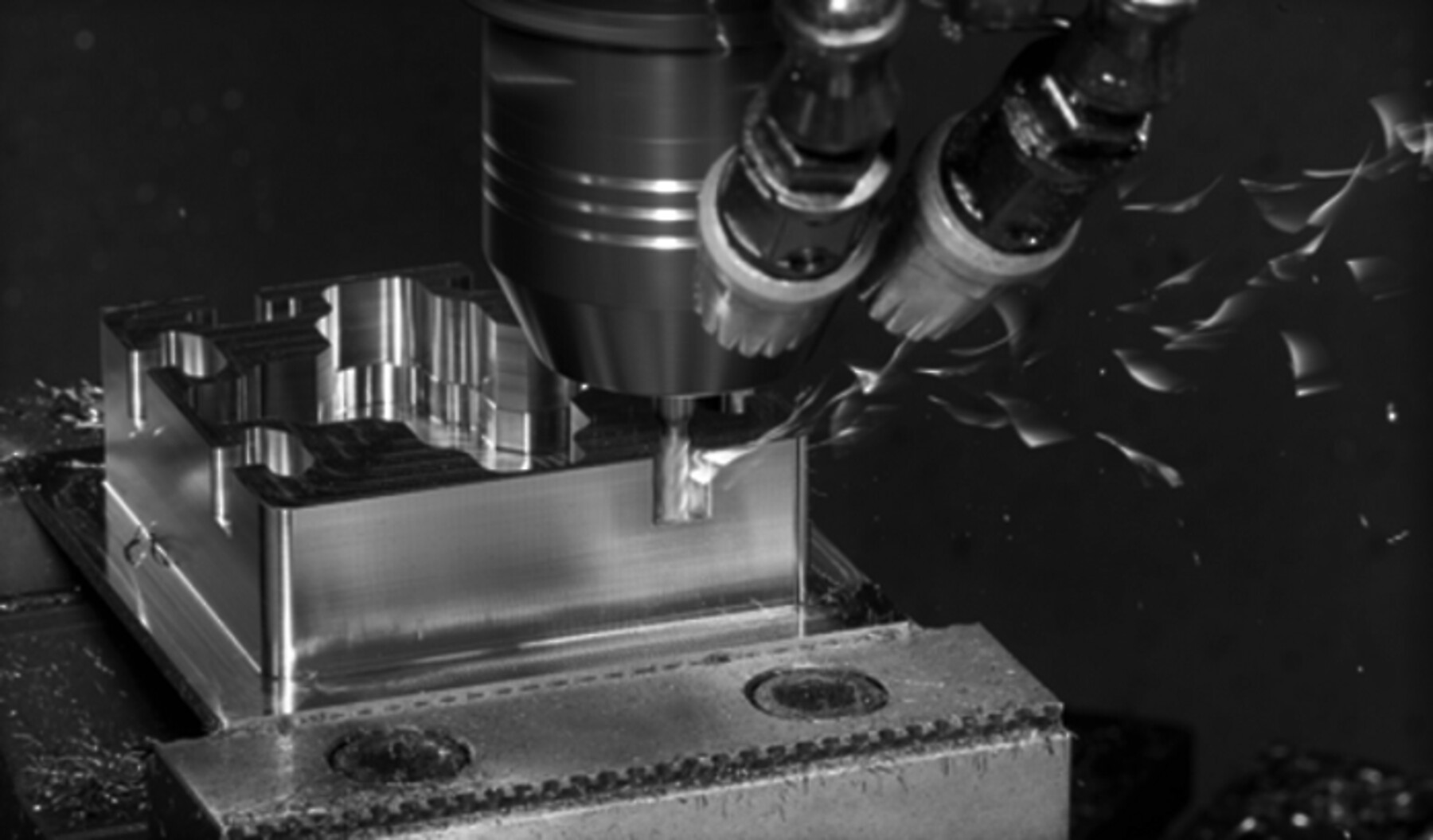 CNC milling machine cutting an aluminum part